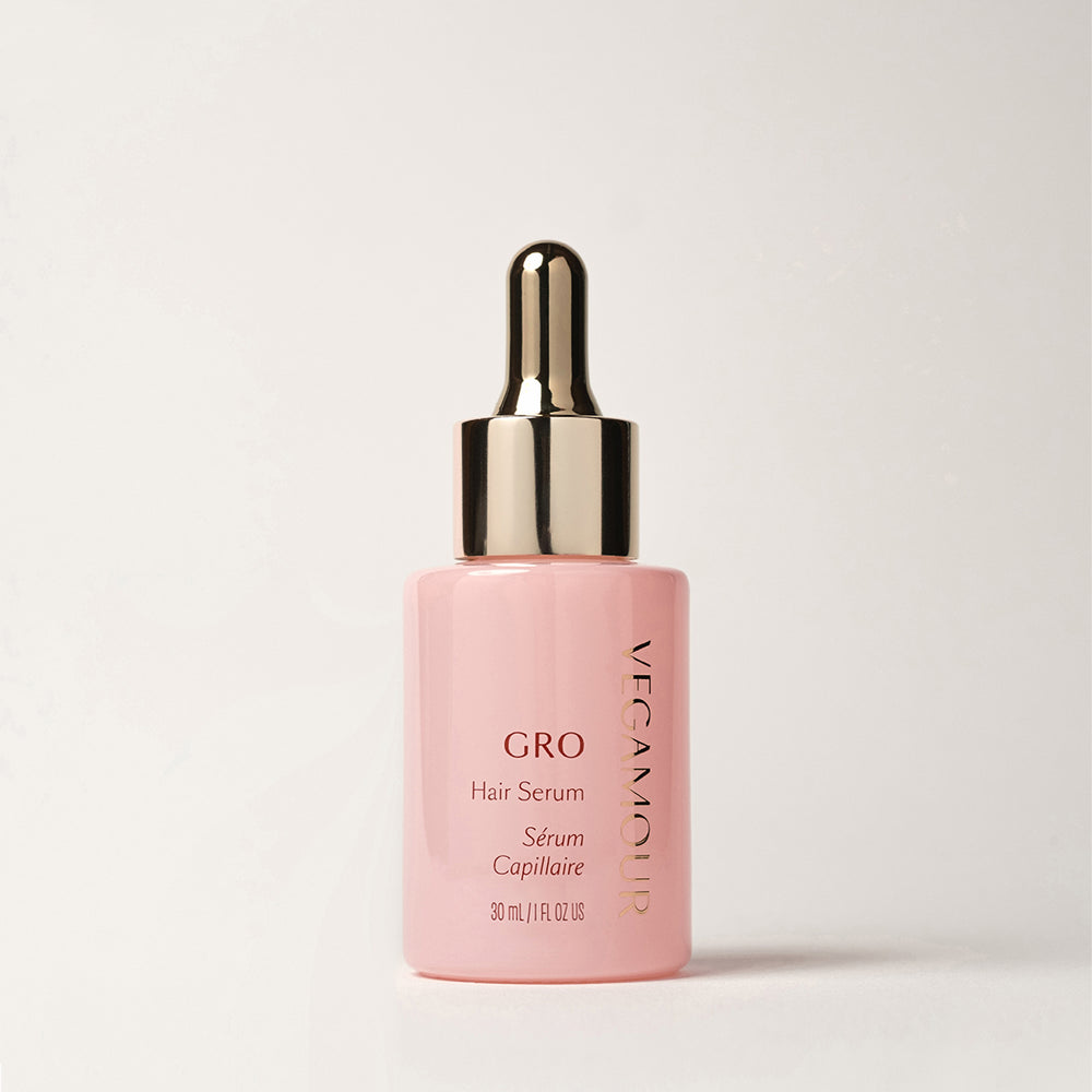 Vegamour GRO Hair Serum, 30 ml pink bottle with a gold dropper.